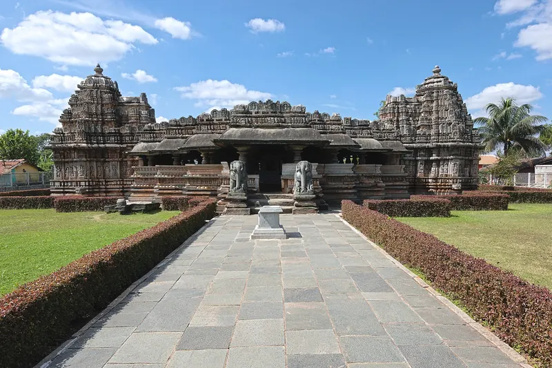 A stone path through the garden to the Veera Narayana Temple at Belavadi